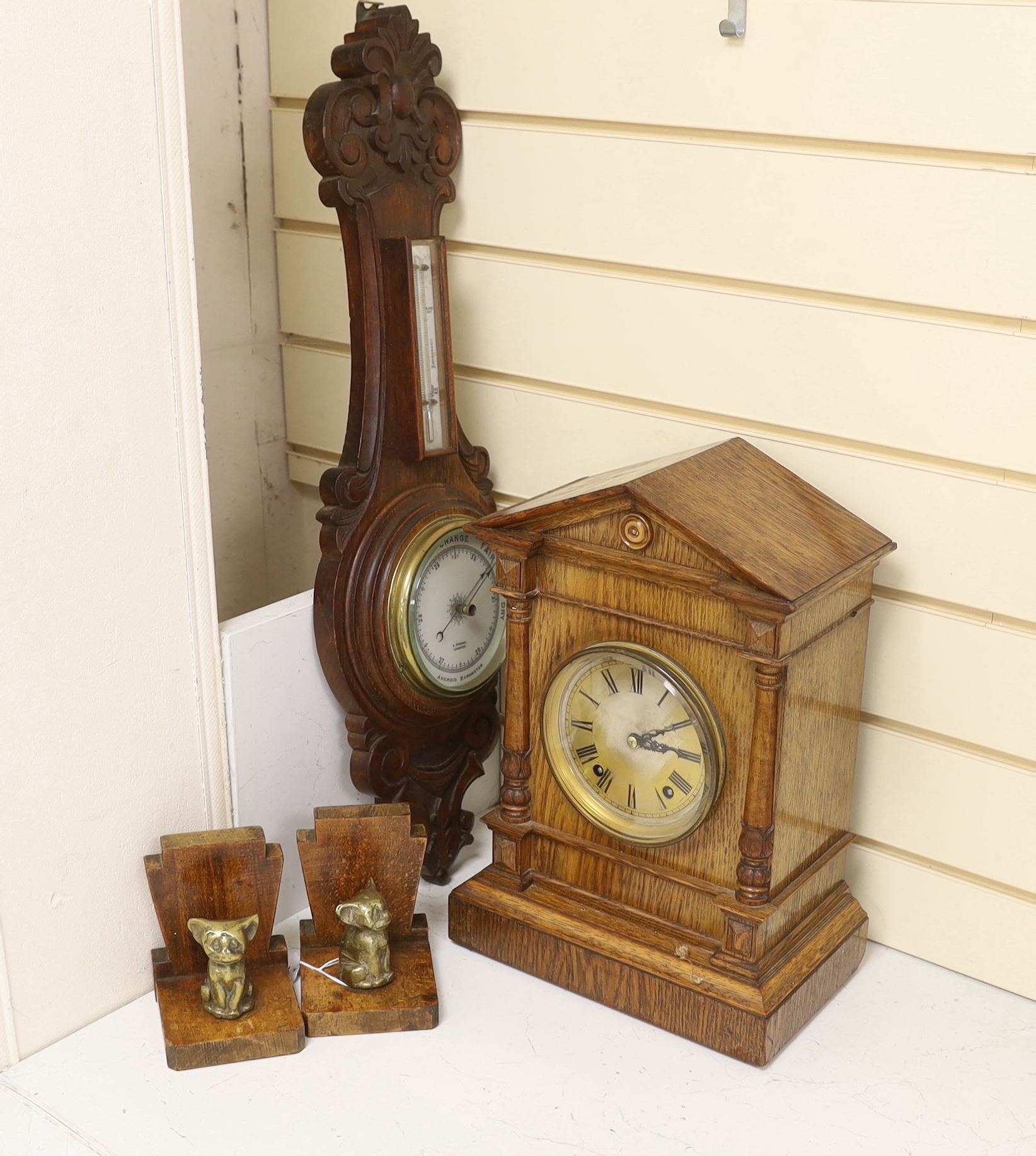 Woodenware including Art Deco bookends, a Black Forest Winterhalder and Hofmeier clock striking on a coiled gong and an aneroid barometer, clock 38cm